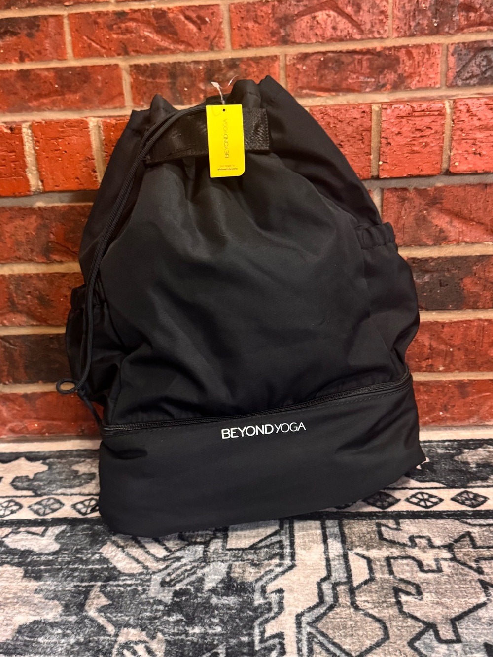 New with Tag Beyond Yoga Black Drawstring Backpack with Front Zip Pocket